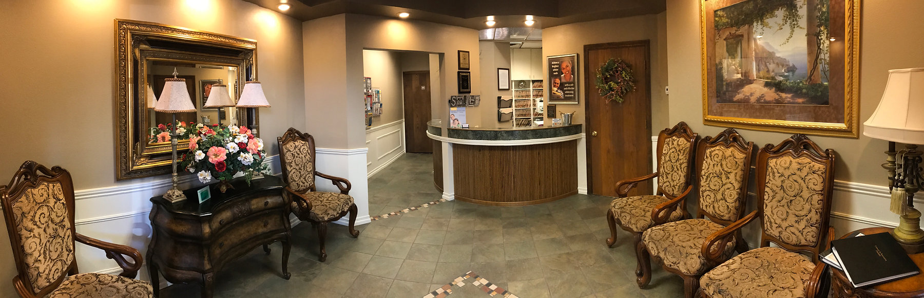 The warm, elegantly appointed reception lobby at Ronald R. Marshall, DDS